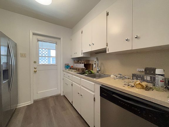 Kitchen with dishwasher, disposal, under counter lighting. Door to side entry, carport, washer dryer.