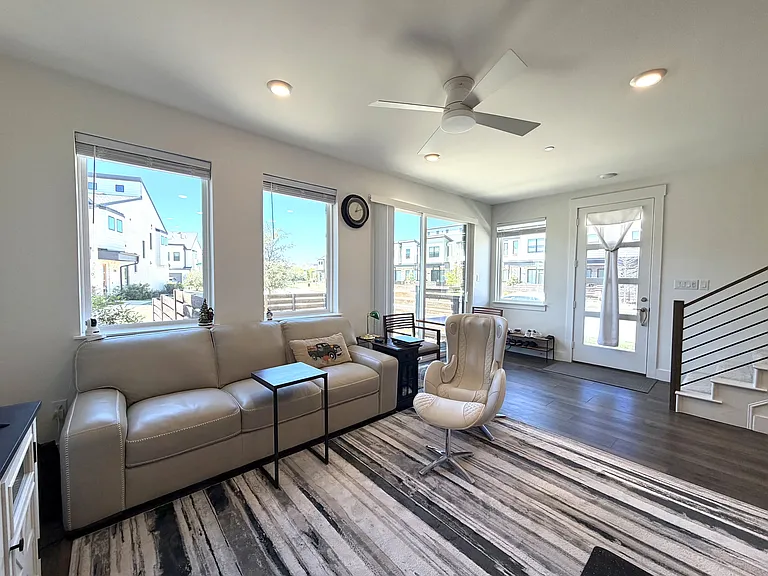 An open-concept layout seamlessly connects the living, dining, and kitchen areas.