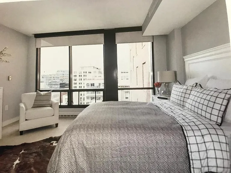 master bedroom with large windows, lots of light