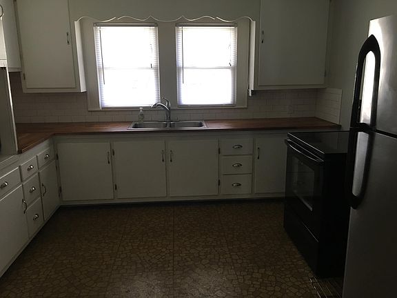Rich butcher block countertops.