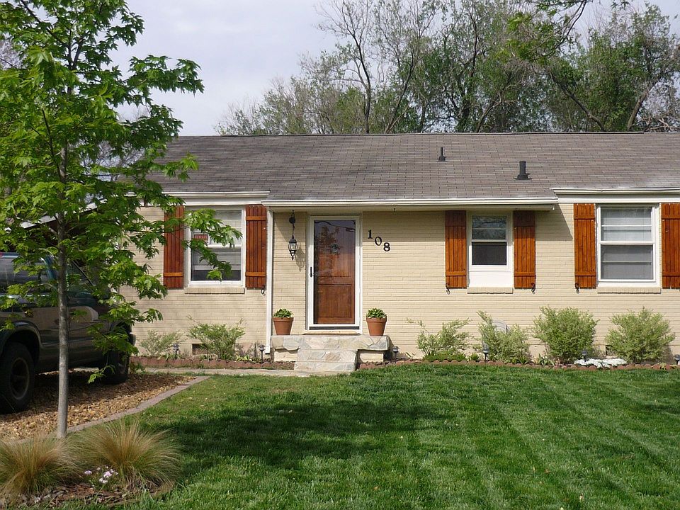 View from Stirton Rd; cedar shutters w/ iron tiebacks