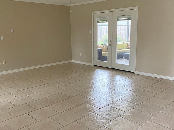 Living area with view to covered patio.