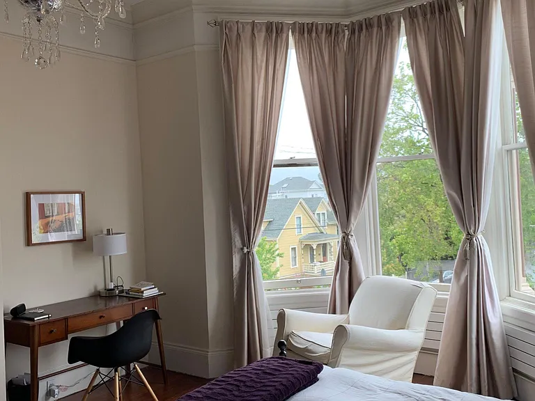 There is room for sitting area and furniture in the front room. Here it's used as the bedroom.