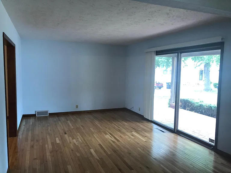 living room with sliding door to front porch