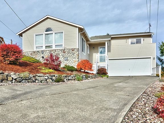 Front door faces south with views to the east. Lots of natural light. Master bed w/deck is above garage.
