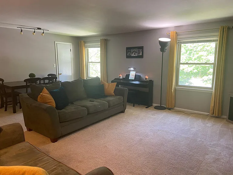 Living Room - Bright living space with updated neutral paint and plenty of room for furniture
