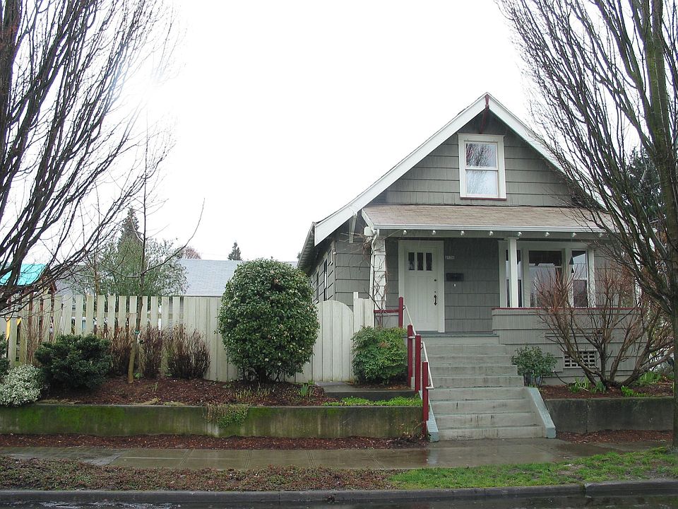 Front of home with side yard visible