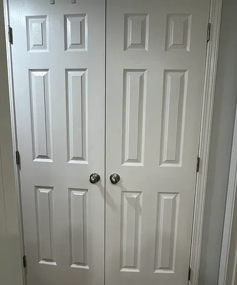 Large and handy storage closet in hallway between bedrooms.