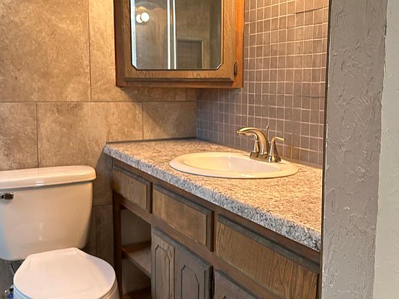 Bathroom with shower. No tub.