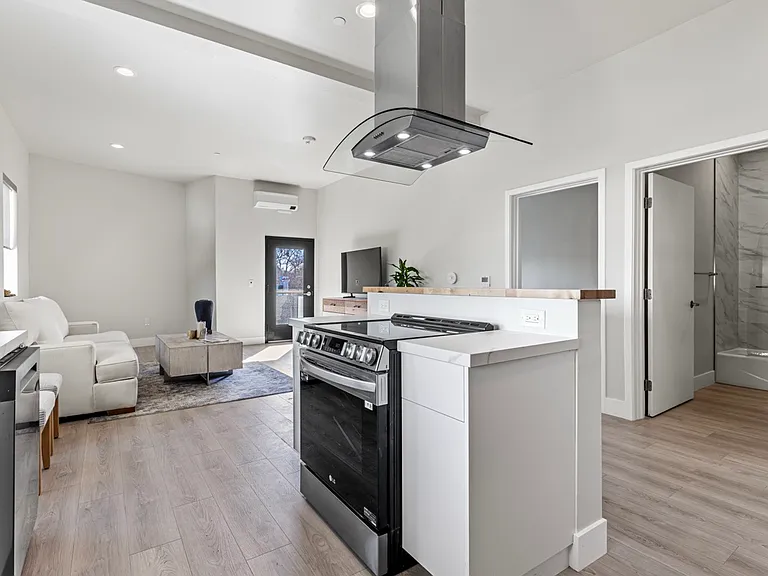 Spacious and bright kitchen area, perfect for cooking up delicious meals and creating lasting memories with loved ones. Plenty of room for culinary creativity to flourish!.