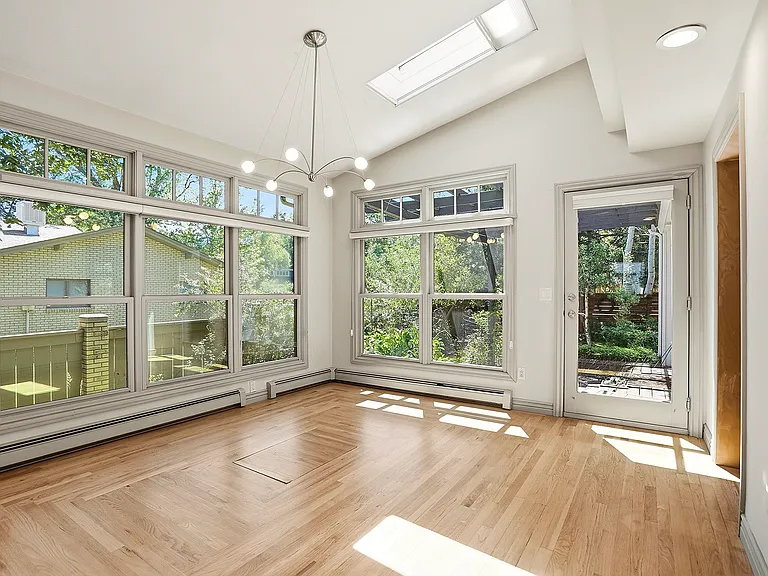 Surrounded by walls of windows, the dining area offers a front-row seat to Colorado's changing seasons, making every meal feel connected to nature.