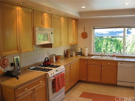 Remodeled Kitchen featuring custom Ceasarstone Countertops, Wilson Art Flooring and custom Cabinetry