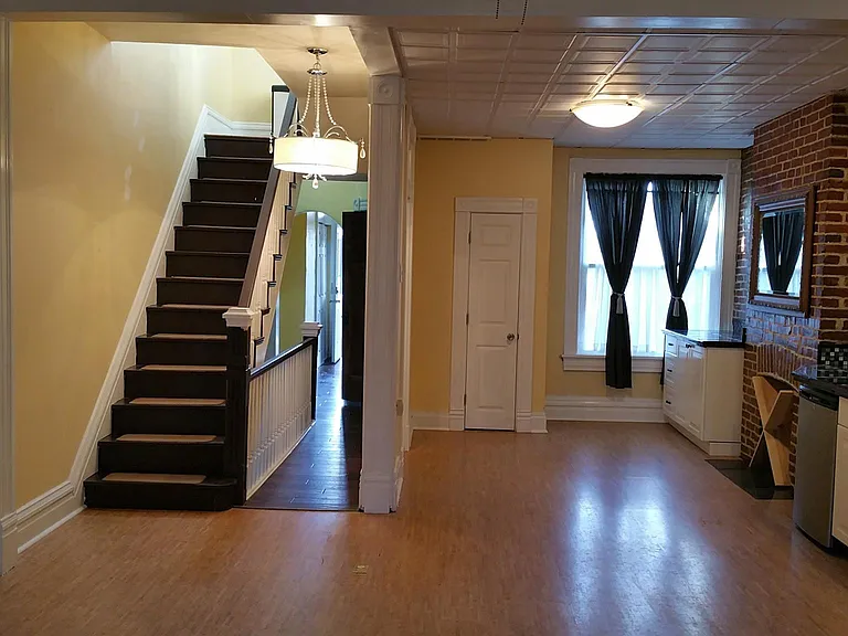 Dining area includes beverage storage built into an old fireplace! Perfect for your wine collection!