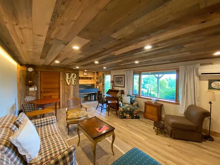 Family room with Antique Desk for working remotely , sofa bed with new memory foam mattress