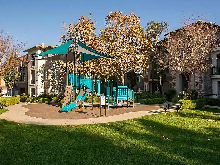 Colorful Children's Play Area With Slides and Climbing Wall