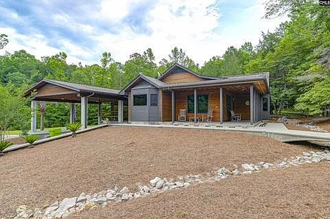 Main house with wrap-around porch.
