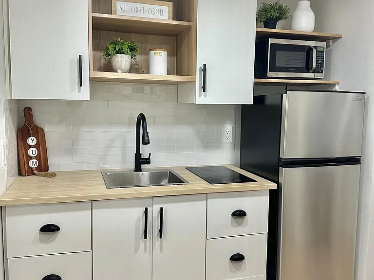 Step into this newly remodeled kitchen, where modern style meets functionality.