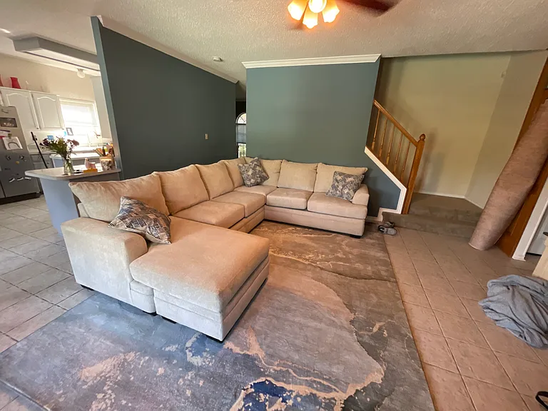 Wall color is the same as the green in the front room now. Fire place and windows looking out towards the beautiful backyard with pool. More photos to come
