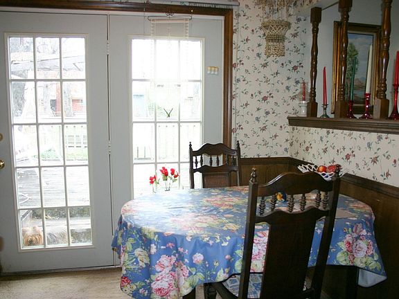 Breakfast nook has a great view of the backyard through the atrium doors.