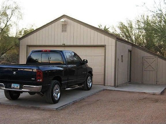 2 car attached garage with 2 car carport, and detached 2 car garage/workshop