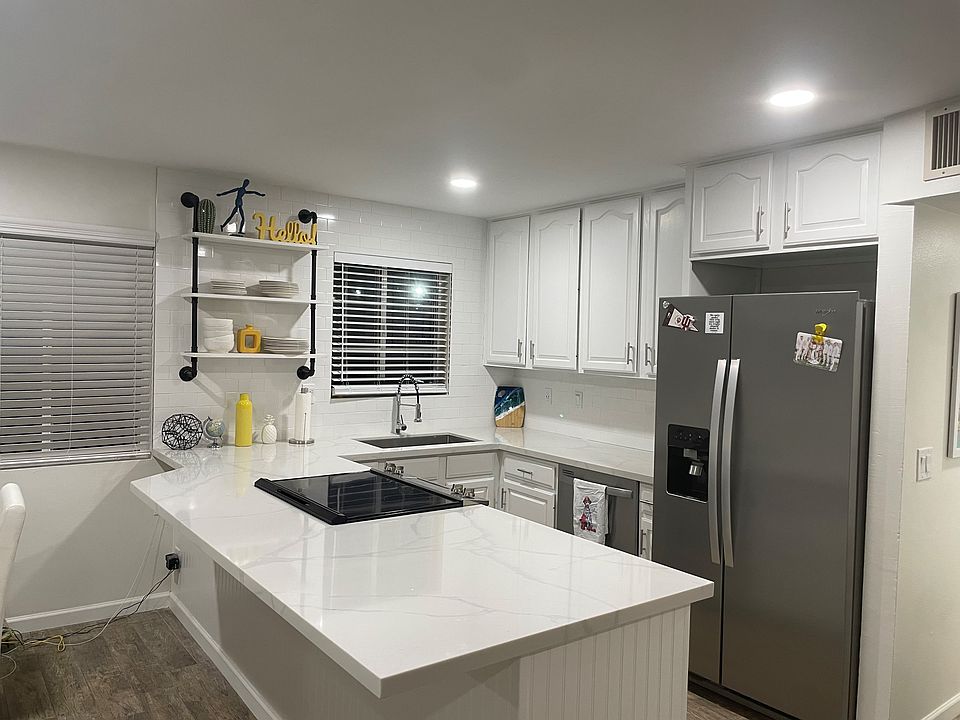 Kitchen with Stainless-Steel Appliances 
- Dishwasher
- Oven
- Stove
- Microwave

There are 2 fridges in this home (1 in Kitchen & 1 in Laundry Room)