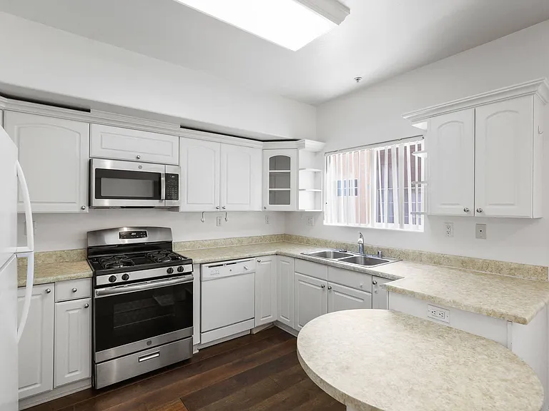 Kitchen with Energy-Efficient Stove and Microwave Oven