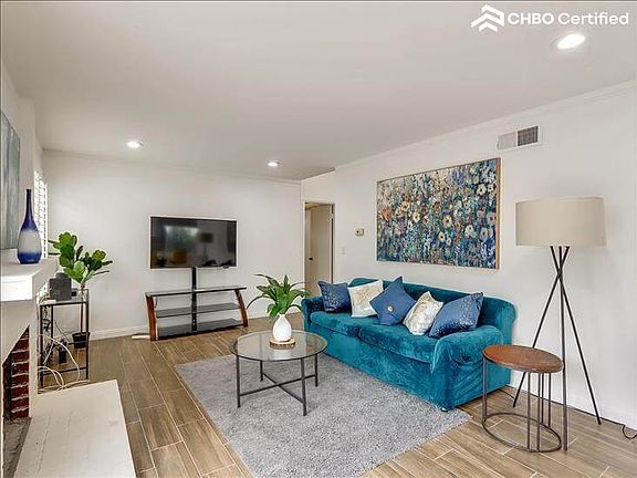 Family room with fireplace and TV