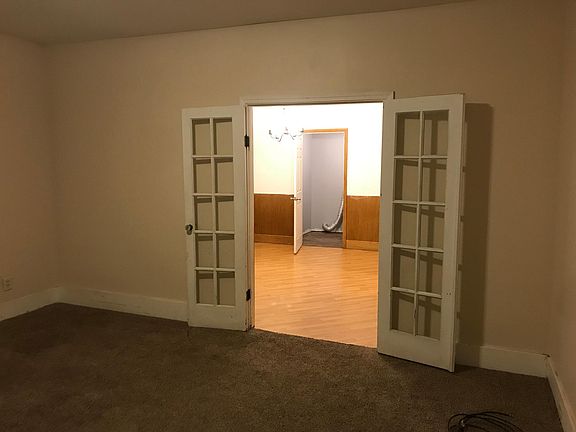Living Room into Dining Room into Bathroom/Laundry