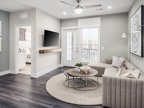 Sunlit Living Room with Access to the Balcony