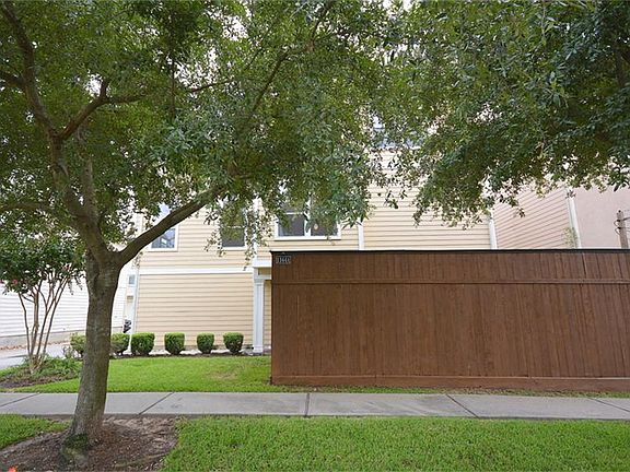 Extra high privacy fence encloses the side patio/yard.