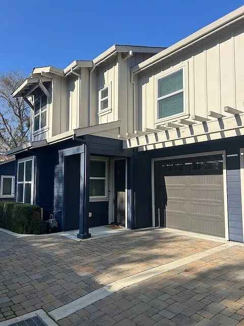 Garage and front door of Unit 1
Shows the 2 story townhouse that it is