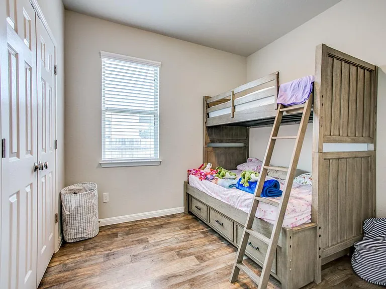 Hard flooring in all bedrooms~ No carpet~ 2 SECONDARY BEDROOMS across from hall full bathroom... sizes 10 X 12 (this bedroom #1 pic reflects bunk bed in room when it was furnished)