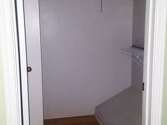 walk in closet with shelves and built ins for plenty of stor