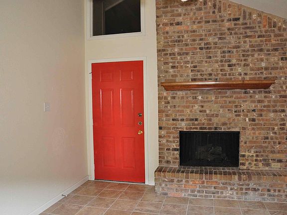 Entry and wood-burning fireplace