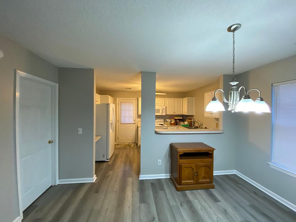 Kitchen and dining room area. Door on left is to the master bedroom and on-suite.