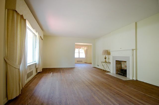 Large living room with hardwood floors and fireplace