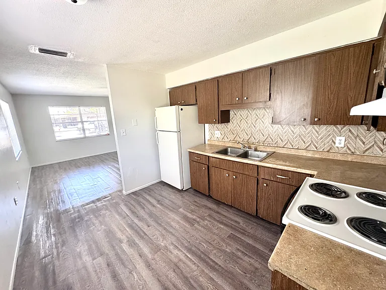 Interior photos are of a neighboring unit with identical floor plan. Paint color is the same, but the flooring is actually ceramic tile.