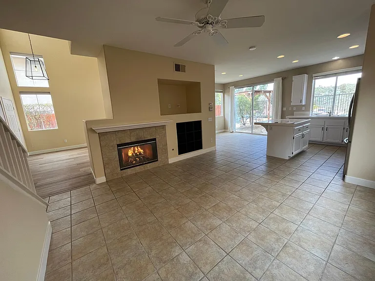 Cozy family room with open floor plan to the kitchen