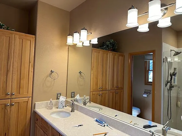 5 piece primary bathroom with ample linen closet.