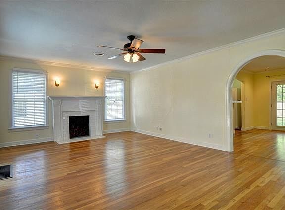 Living room with lots of natural light, beautiful floors