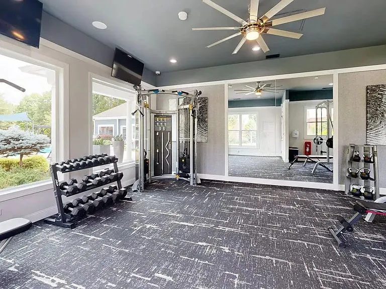 Focus on your fitness goals in our fully equipped weight room, complete with free weights, strength machines, and large windows for plenty of natural light.