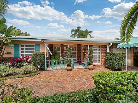 Front view with circular brick driveway