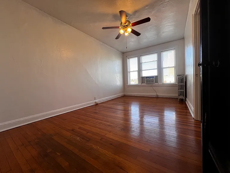 Beautiful hardwood floors, oversized windows, and historic details create a warm and welcoming atmosphere throughout. Perfect for a spacious and comfortable retreat.