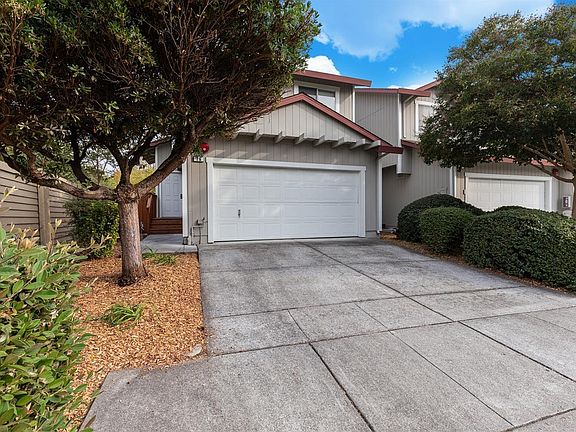 16 Regents Circle, entry to left of garage door, and gate to rear yard to left of entry.