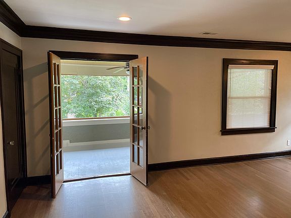 Living room opens to large covered porch