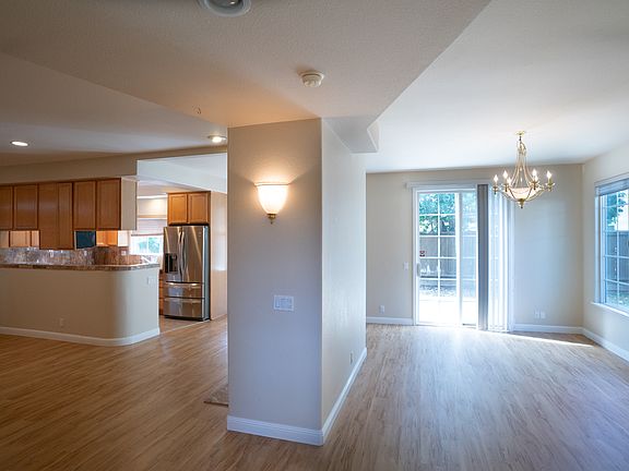 Downstairs. Open floor plan (Kitchen, Living room, Dining room). Access to outside patio