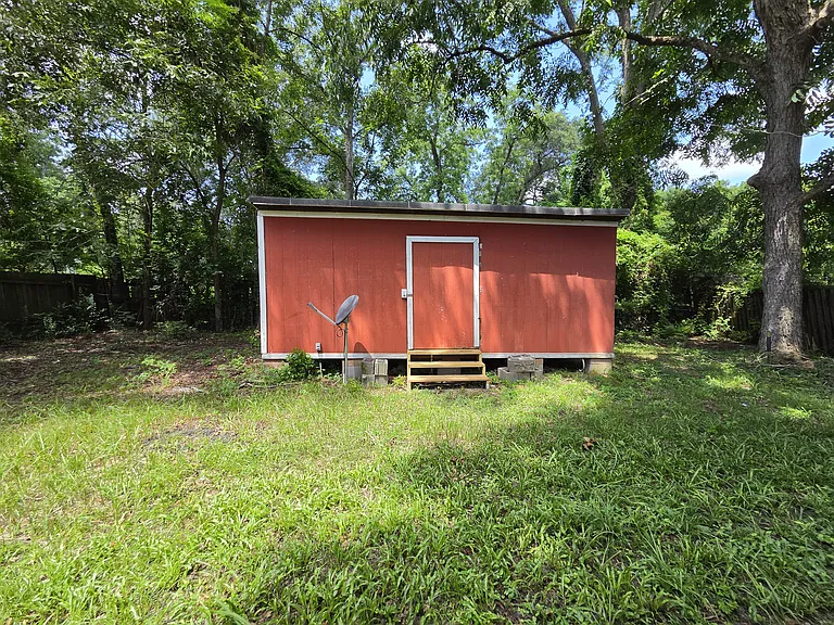 Large storage shed in back