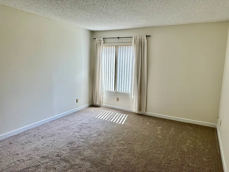bedroom 1 window with treatment and blinds