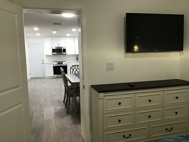 Inside the furnished private guest suite selecting the choice of an open visual connection to the kitchen and main residence.