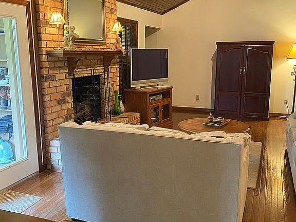 Den with wood ceiling